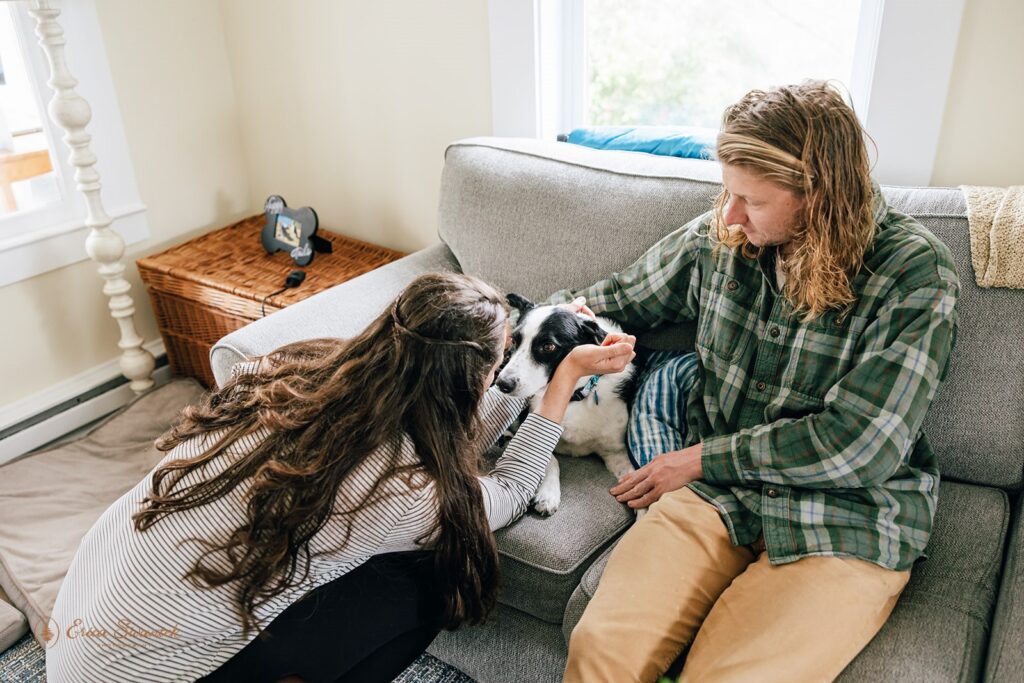 elopement couple cuddling their dog at the airbnb