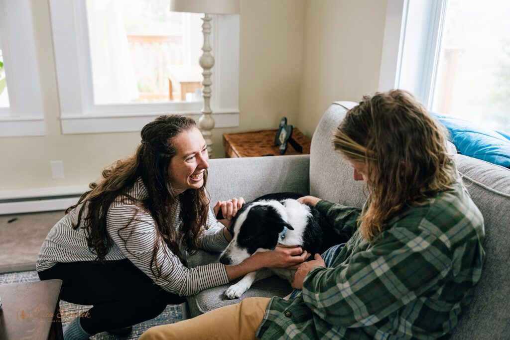 elopement couple cuddling their dog at the airbnb