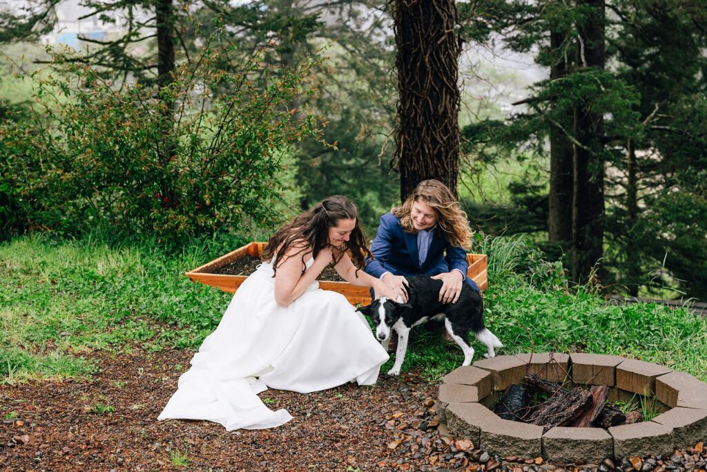 elopement couple cuddling their dog during their dog friendly wedding elopement in PNW