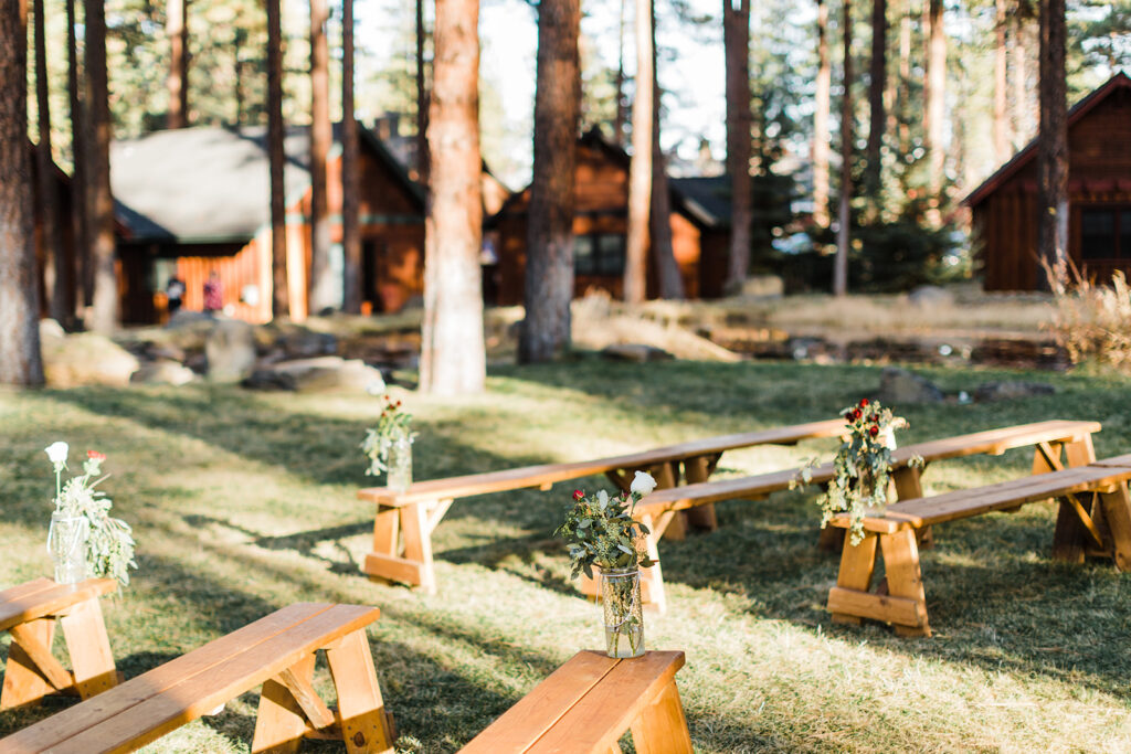 outdoor ceremony bench set up at fivepine lodge wedding venue