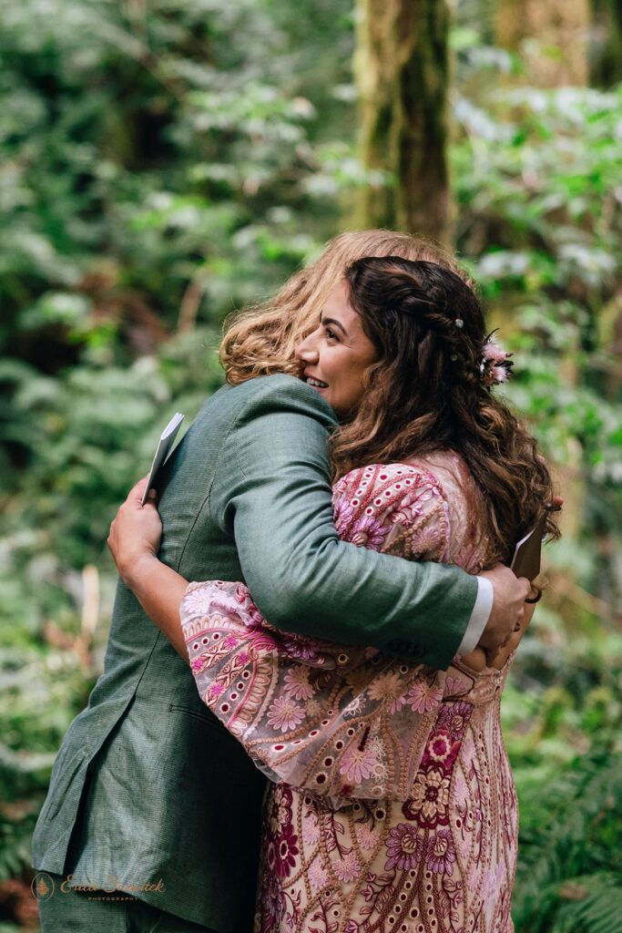 bride and groom and their dog at the rainforest trail surrounded by lush greenery