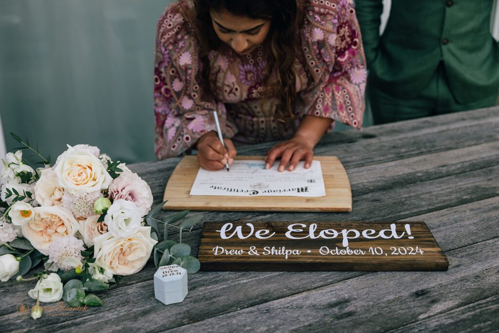 bride signing marriage license