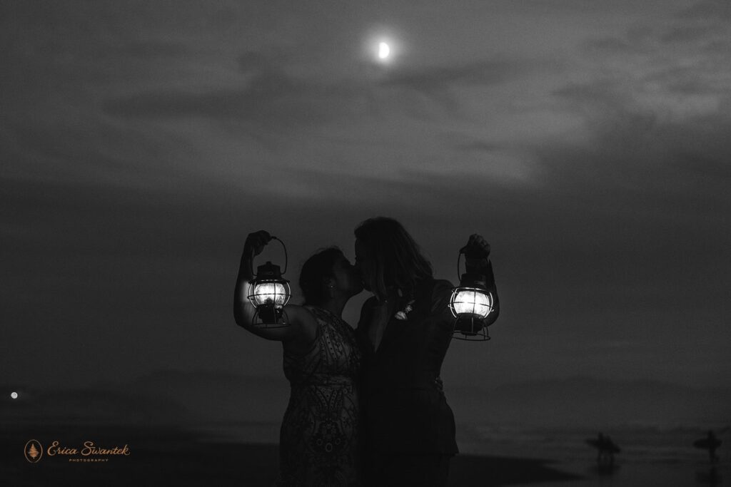 bride and groom with lanterns during the nighttime