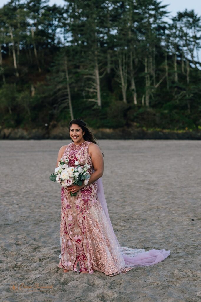 bride in a pink, floral wedding dress