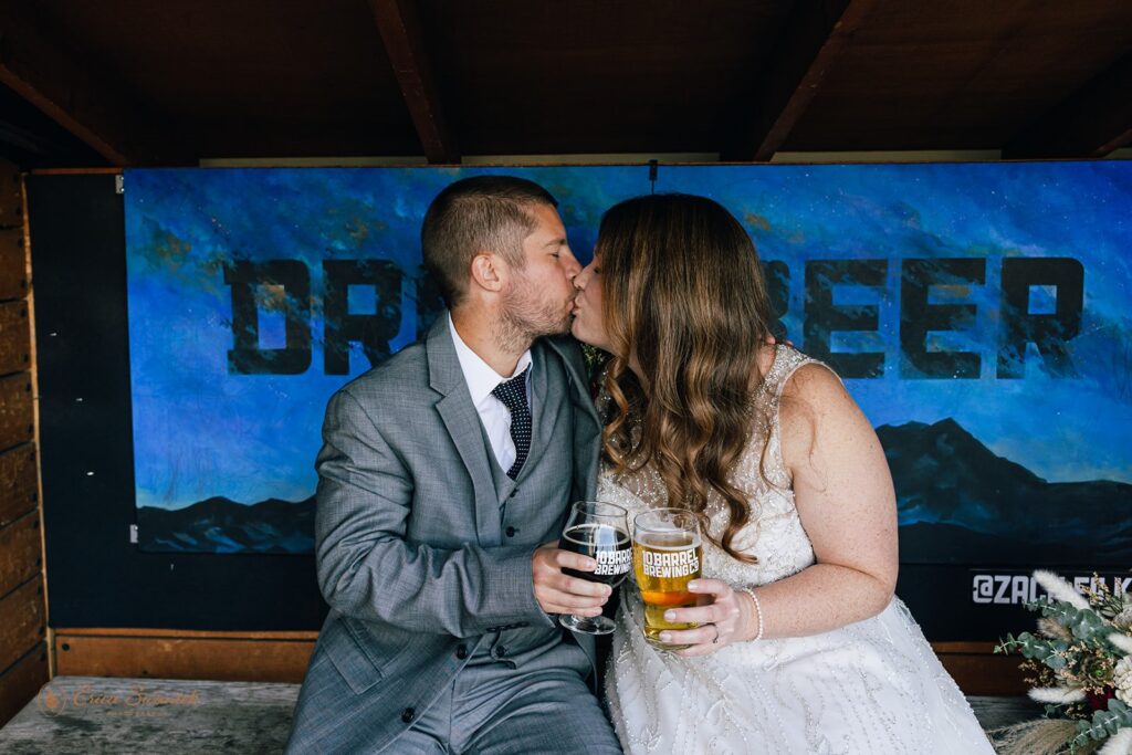 bride and groom photos at a brewery during their bend elopement day