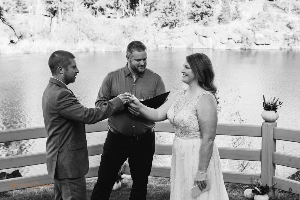 bride and groom drinking celebratory tequila shots