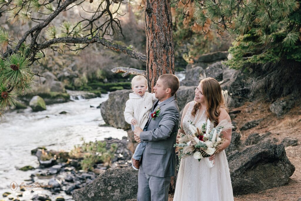 bride and groom and their little son