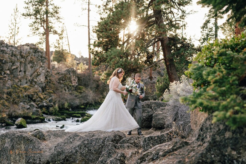 candid bride and groom moments during their bend elopement day walking along the Deschutes River Trail in the Deschutes National Forest