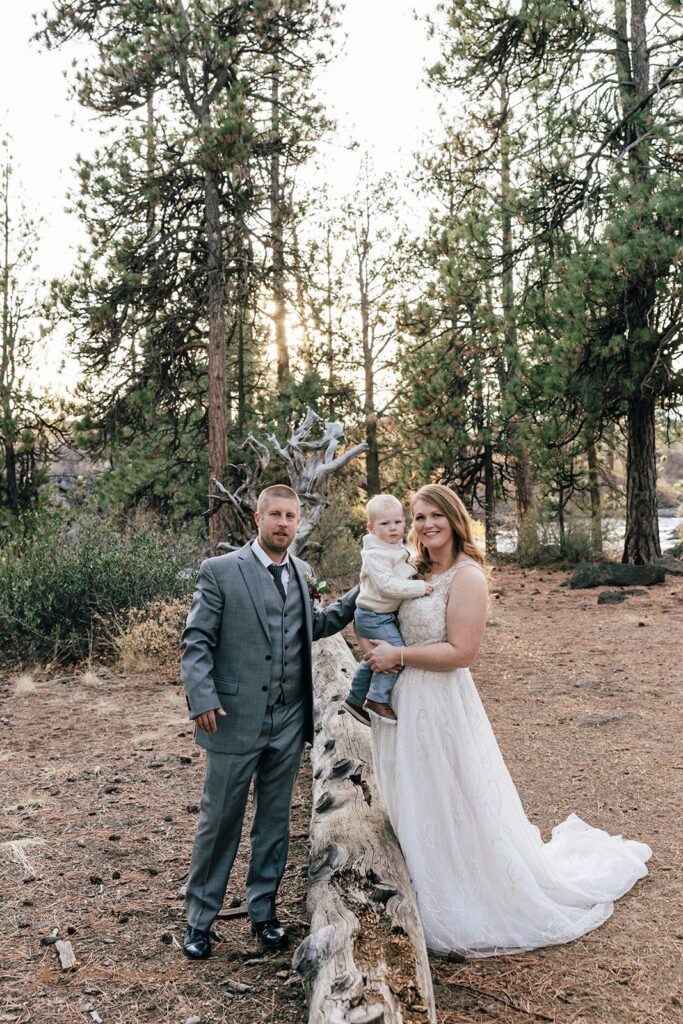 bride and groom and their little son