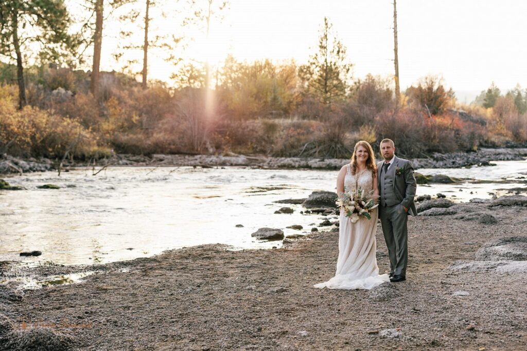 candid bride and groom moments during their bend elopement day walking along the Deschutes River Trail in the Deschutes National Forest