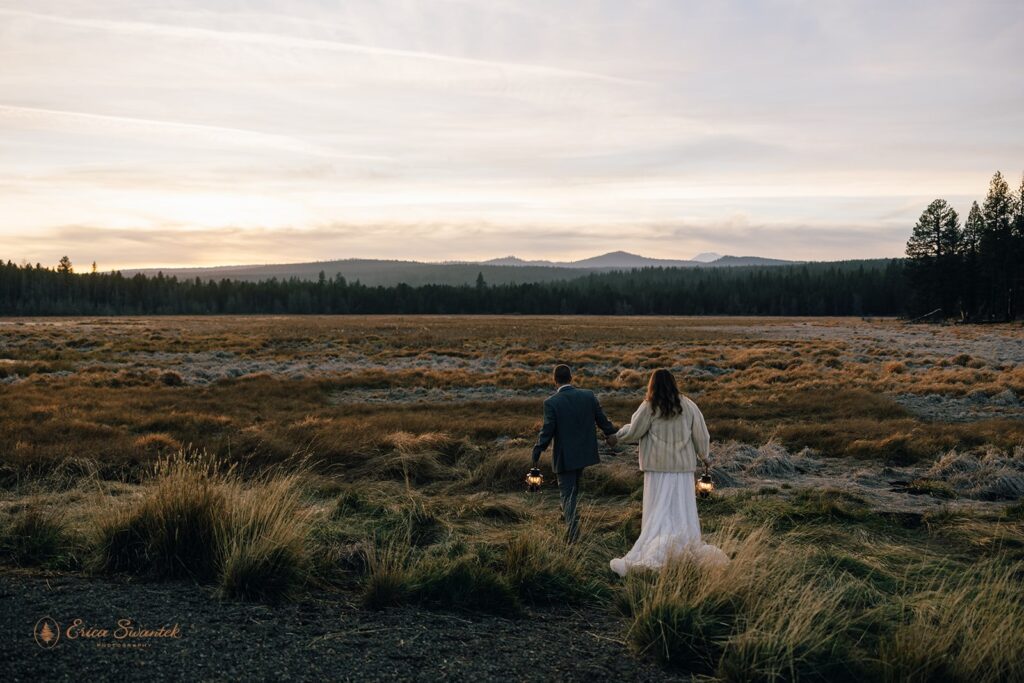 bride and groom evening photos with lanterns with stunning bend, or, landscapes in the backdrop