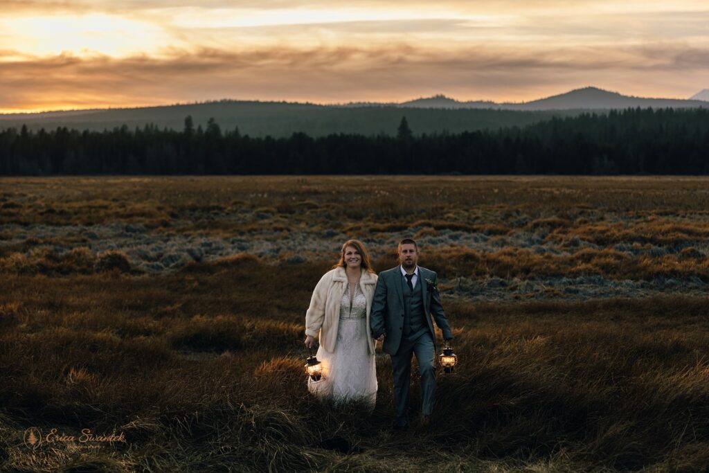 bride and groom evening photos with lanterns with stunning bend, or, landscapes in the backdrop