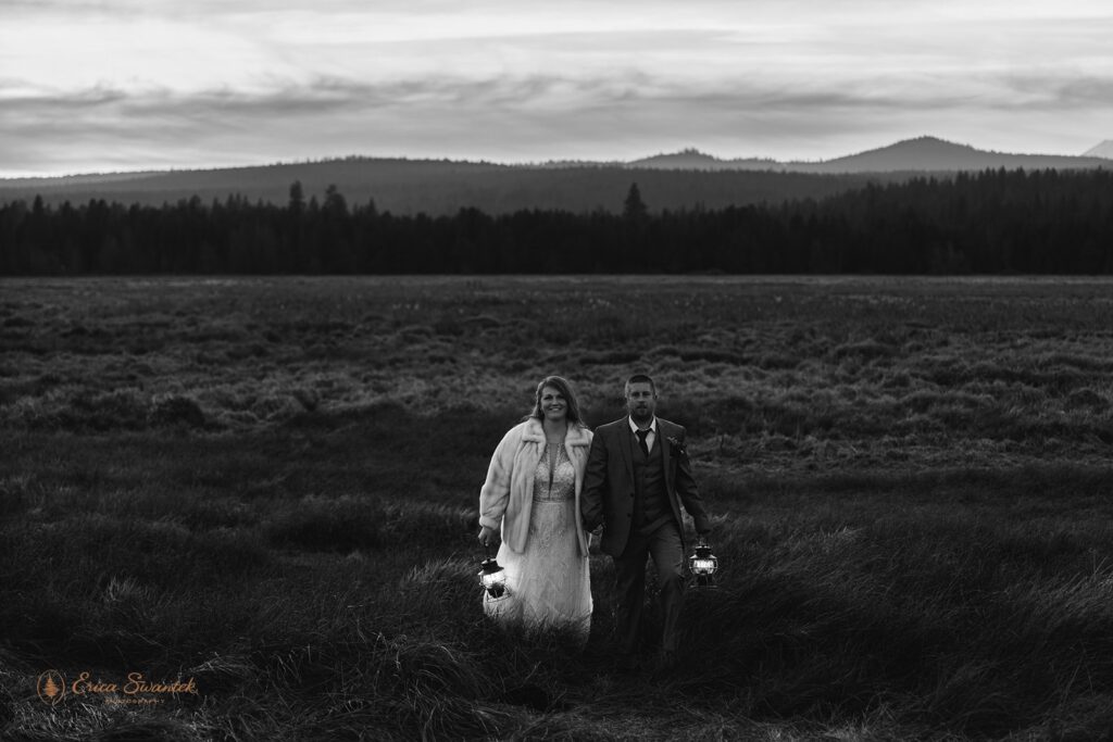 bride and groom evening photos with lanterns with stunning bend, or, landscapes in the backdrop