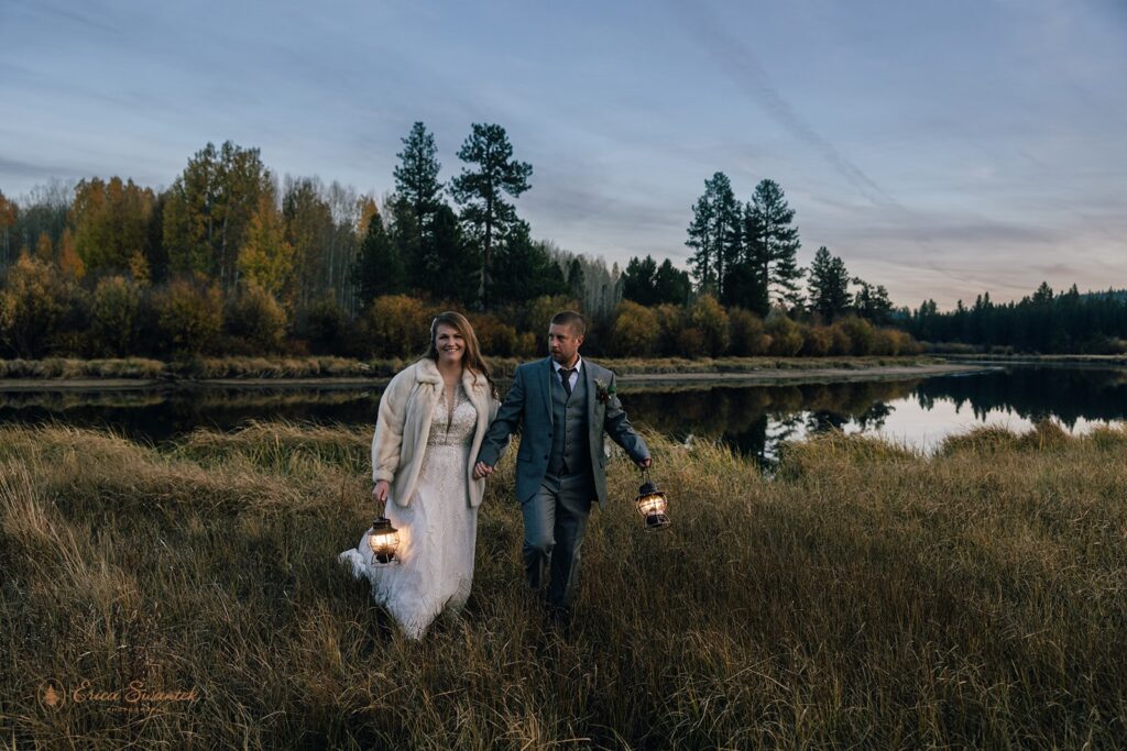 bride and groom evening photos with lanterns with stunning bend, or, landscapes in the backdrop