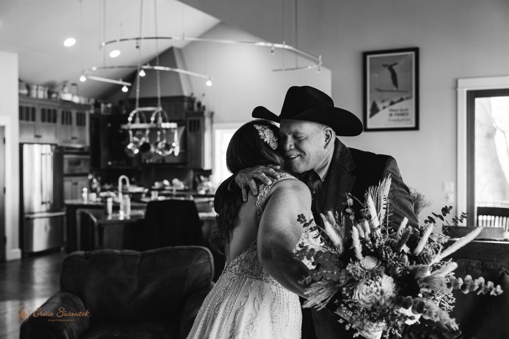 black and white image of bride and dad first look