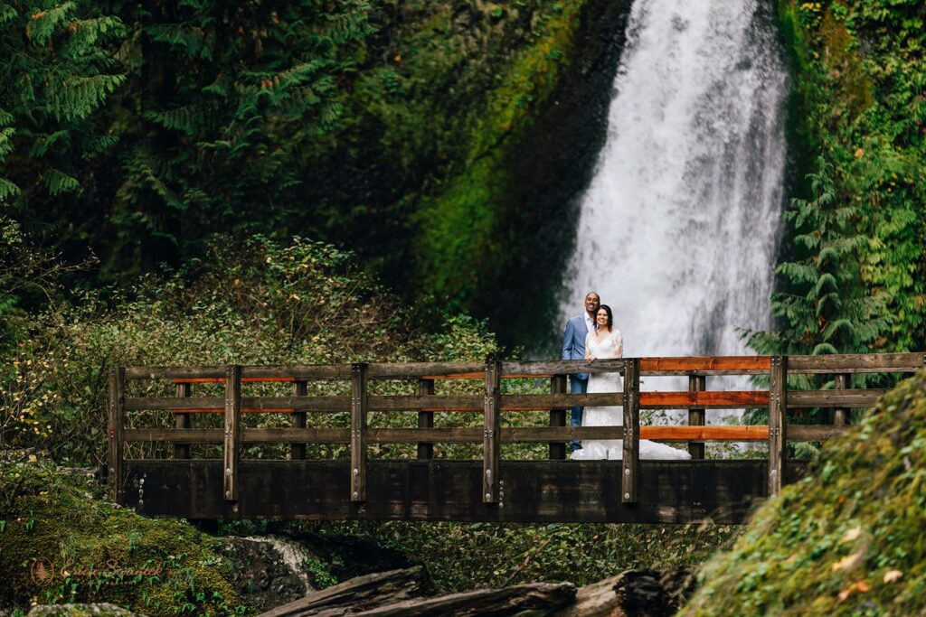 elopement couple with lush greenery and waterfall views in the backdrop