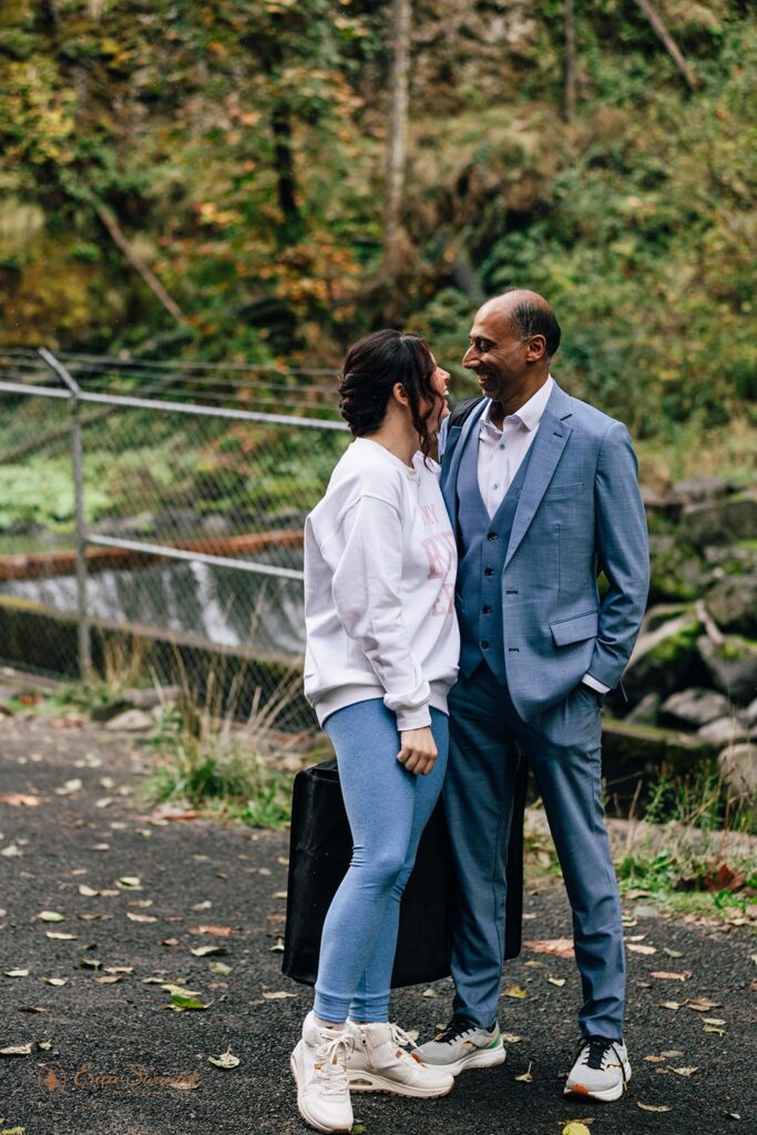 bride and groom hiking to their elopement location