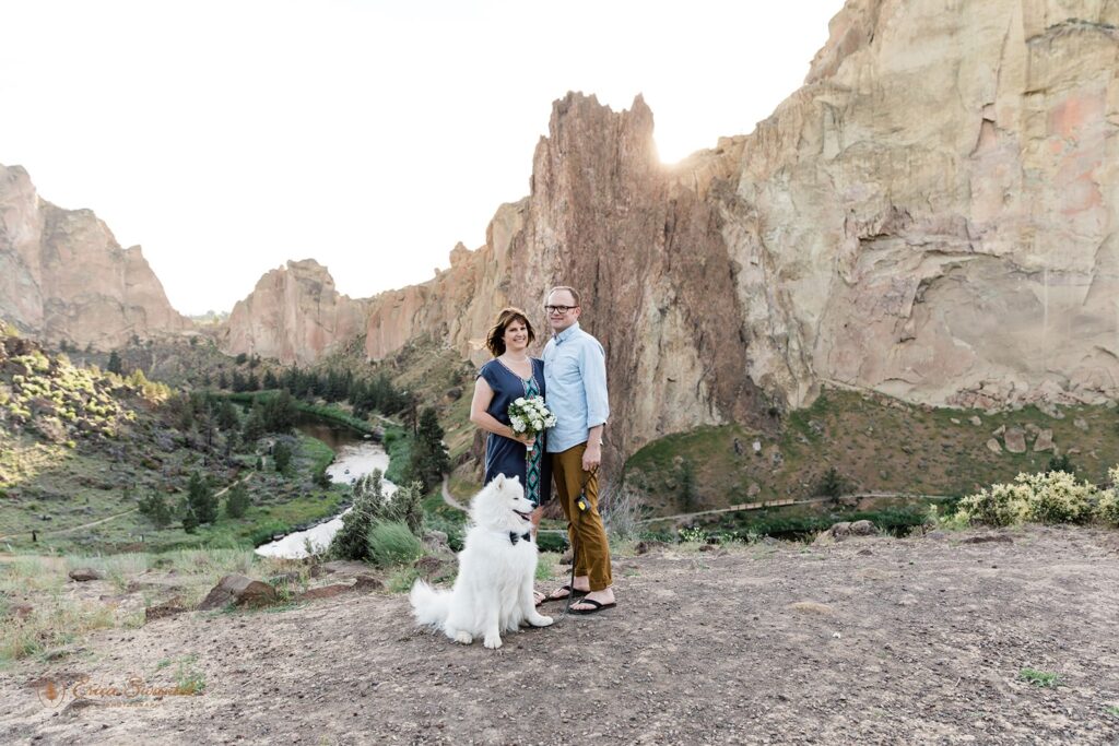 an elopement couple with their dog during their sunset smith rock elopement