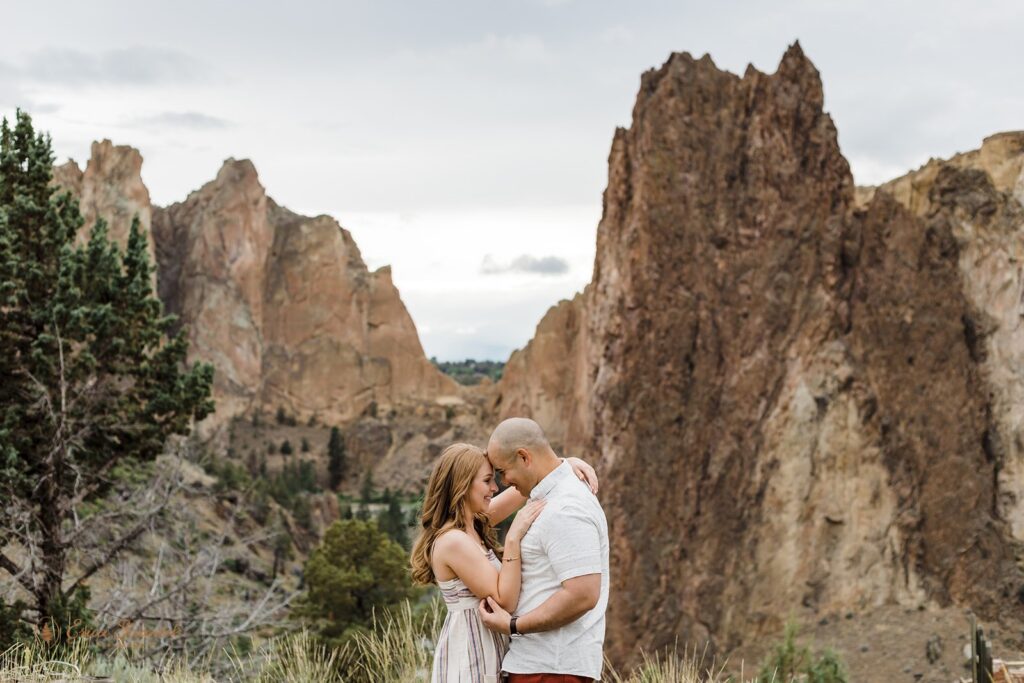 a playful couple at smith rock state park