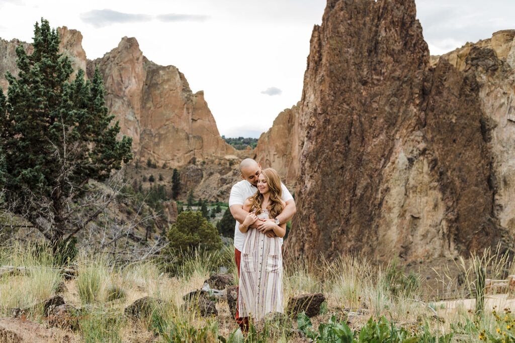 a playful couple at smith rock state park