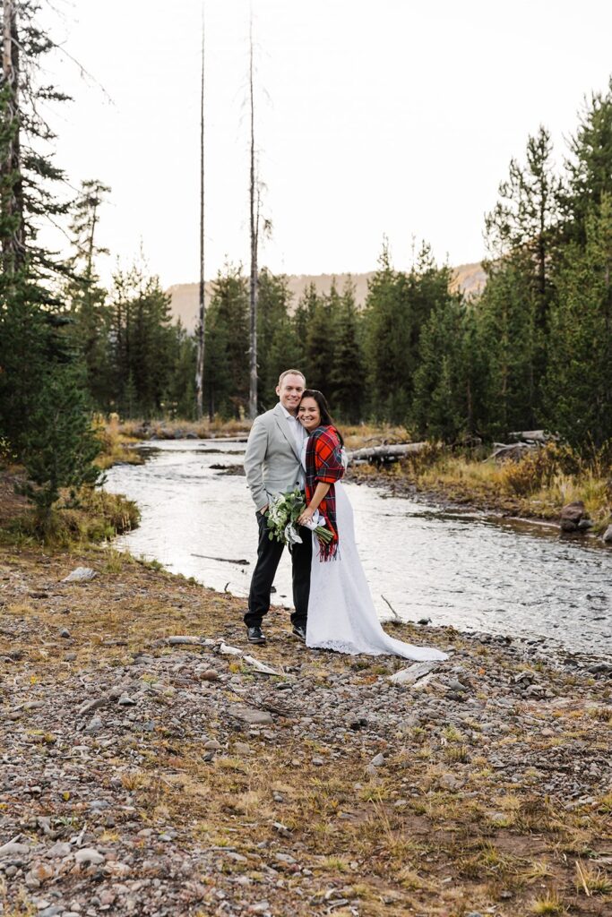 elopement couple cuddling together during their adventurous sparks lake elopement day