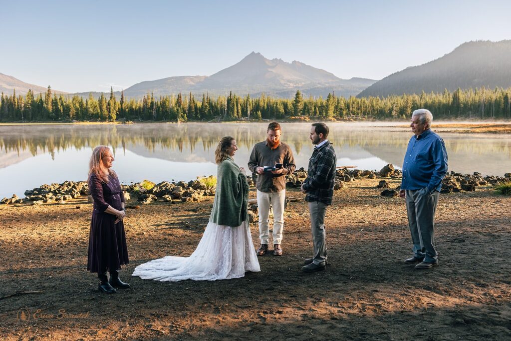 elopement ceremony at sparks lake shore with mountain backdrops