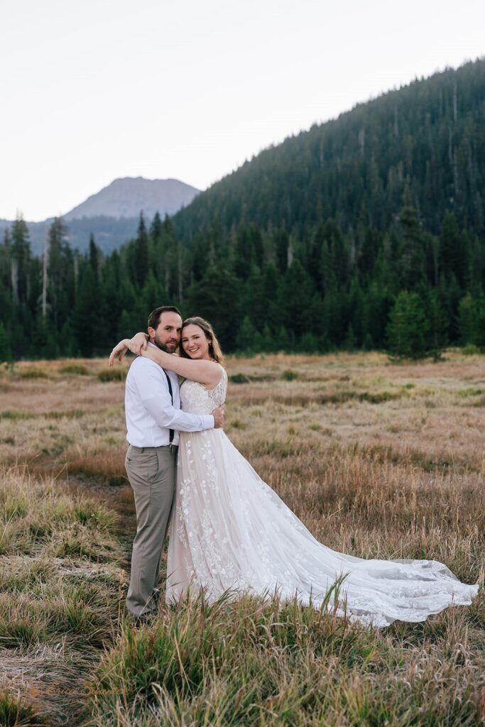 dreamy elopement couple with mountain and forest backdrops during their sparks lake elopement day