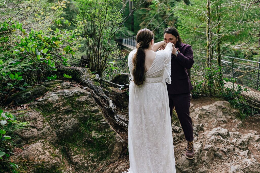 elopement couple first look surrounded by lush forests