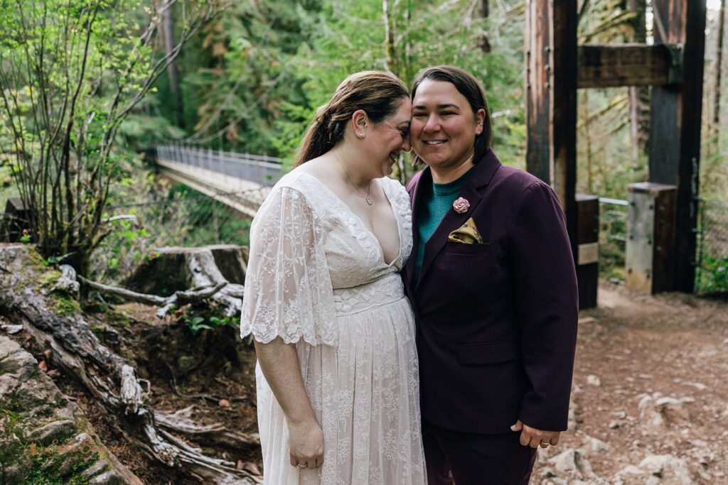 elopement couple first look surrounded by lush forests