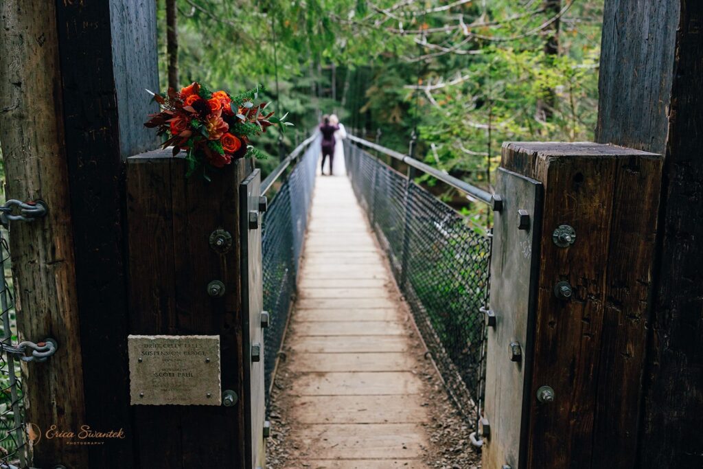 lgbtq hiking elopement photos on the suspension bridge at drift creek falls