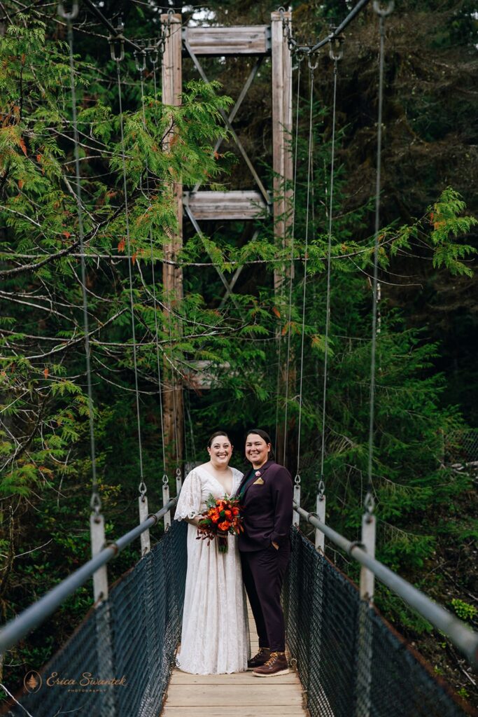 lgbtq hiking elopement photos on the suspension bridge at drift creek falls
