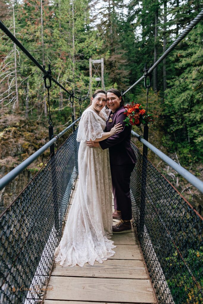 lgbtq hiking elopement photos on the suspension bridge at drift creek falls