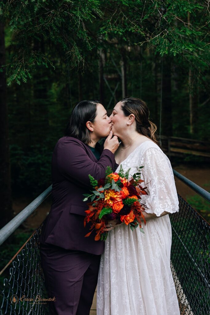 lgbtq hiking elopement photos on the suspension bridge at drift creek falls