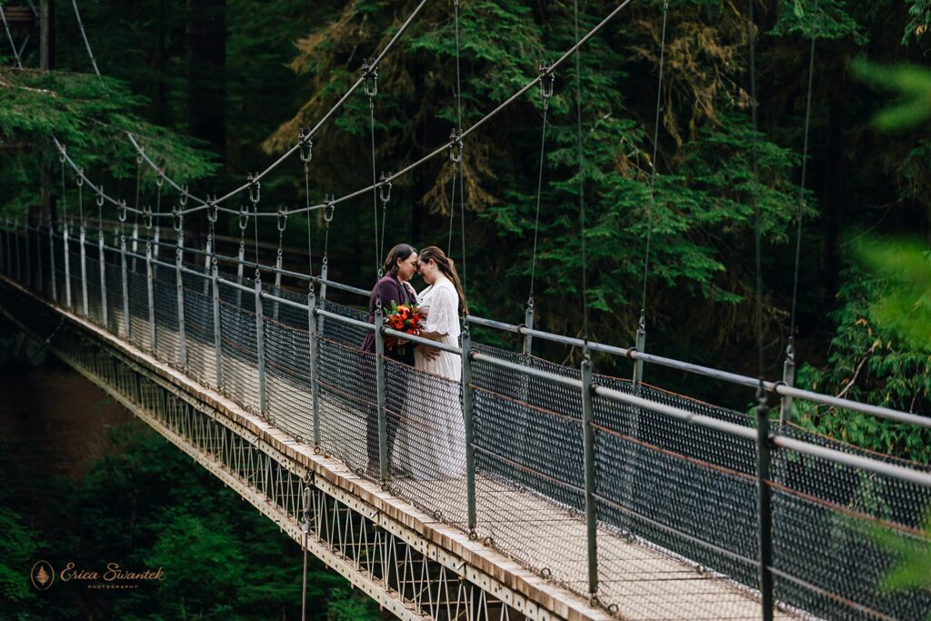 lgbtq hiking elopement photos on the suspension bridge at drift creek falls