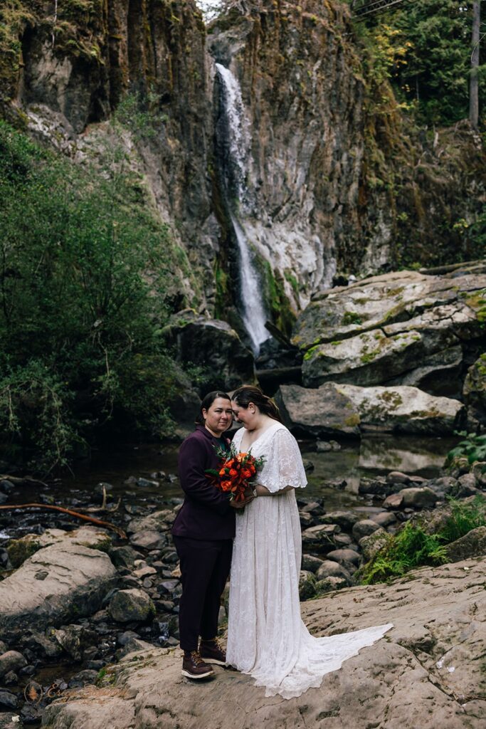 elopement couple with waterfall in the background