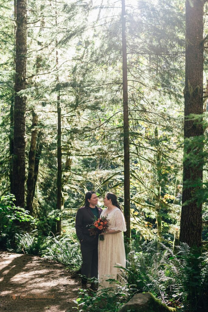 elopement couple surrounded by lush forest