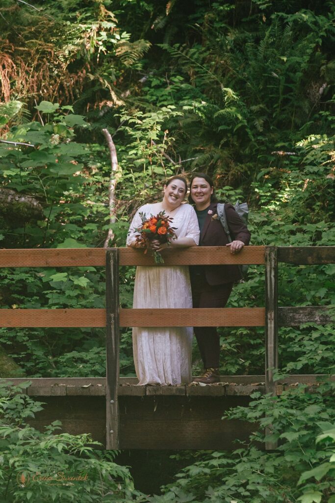elopement couple surrounded by lush forest