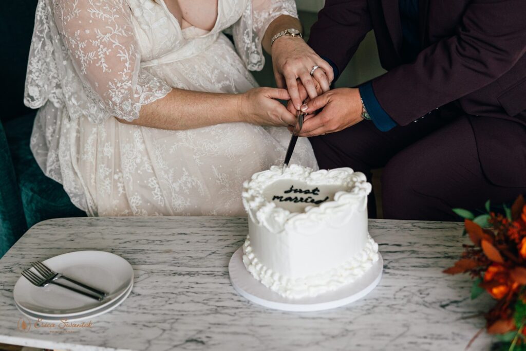 elopement couple cutting cake at their airbnb