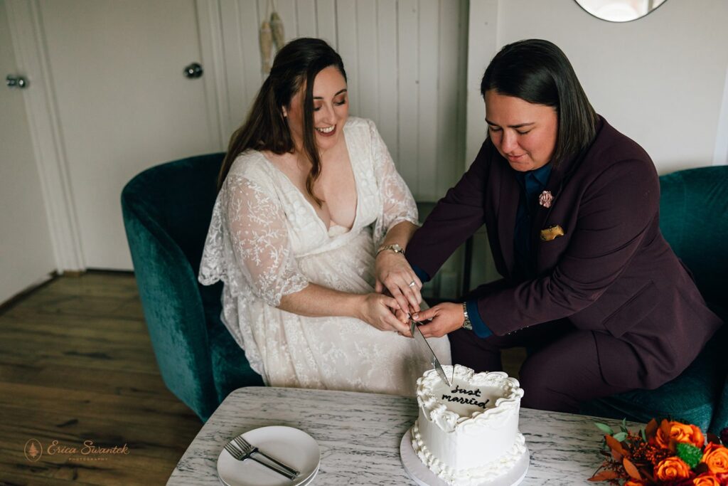elopement couple cutting cake at their airbnb