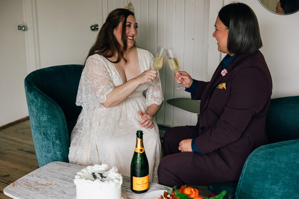 elopement couple toasting champagne