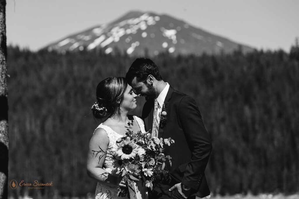 bride and groom in front of mountain views in Oregon