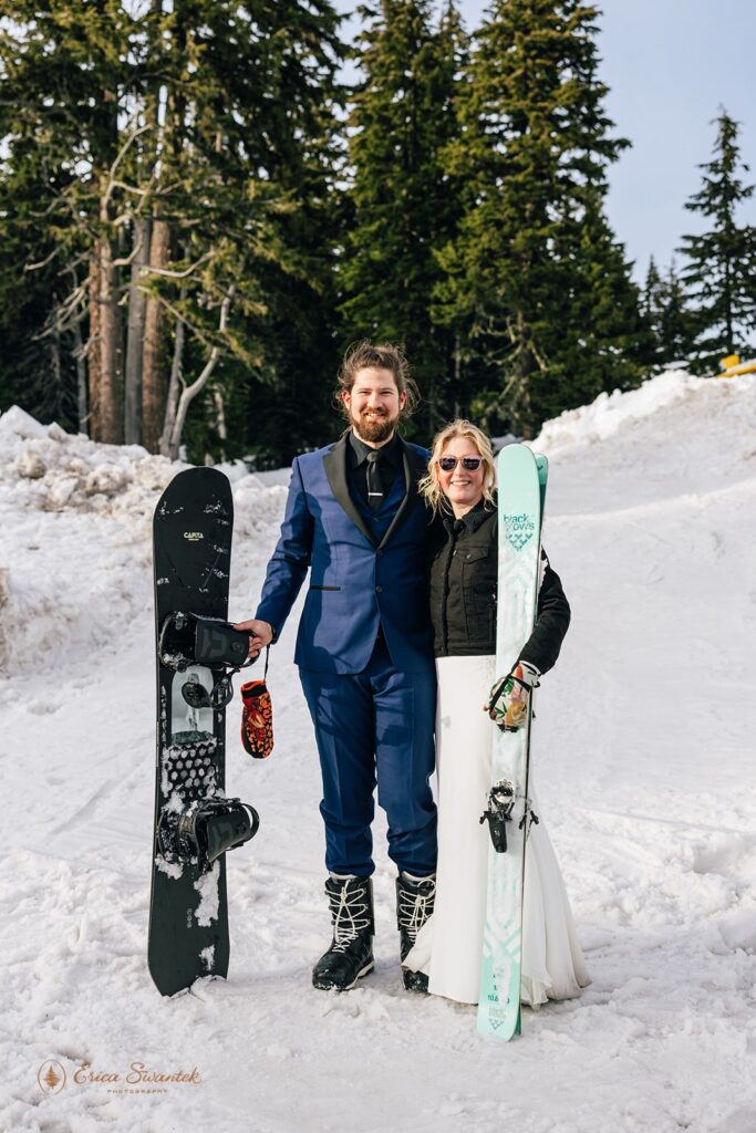 adventurous mt. hood elopement in the winter on the mountain, couple posing with their skis and snowboard