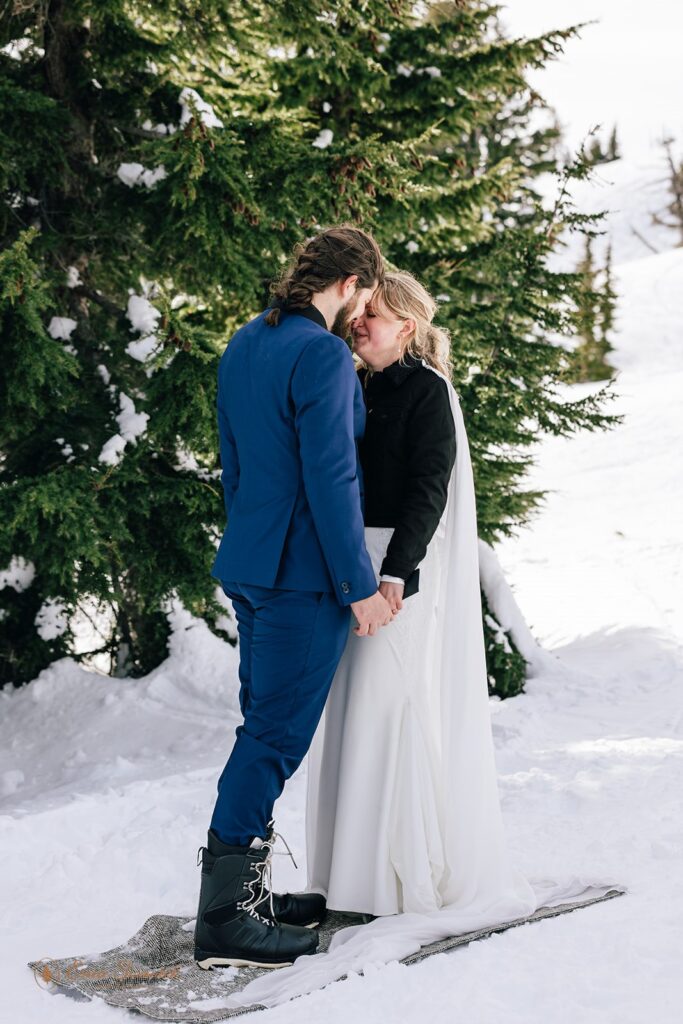 candid winter elopement ceremony on the mountain at mt. hood
