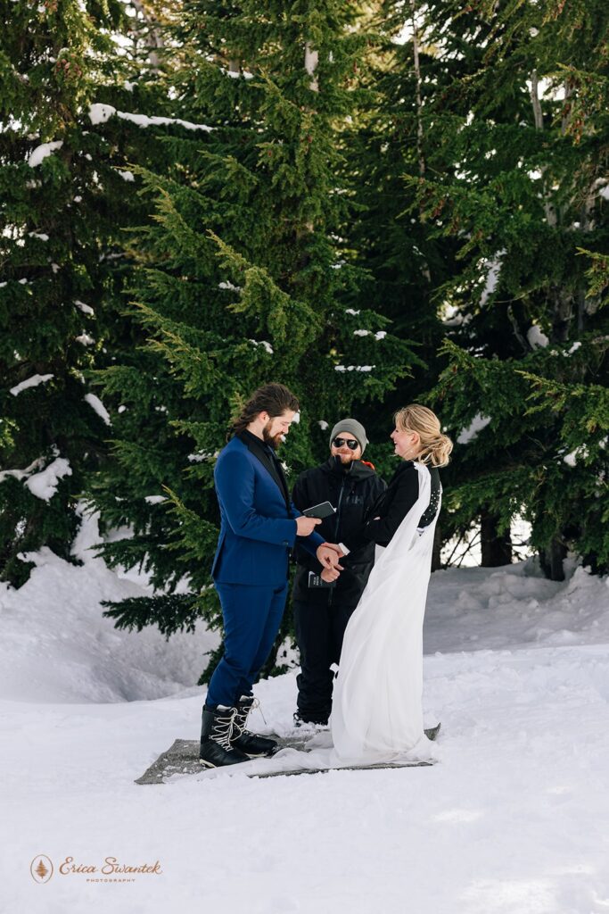 candid winter elopement ceremony on the mountain at mt. hood