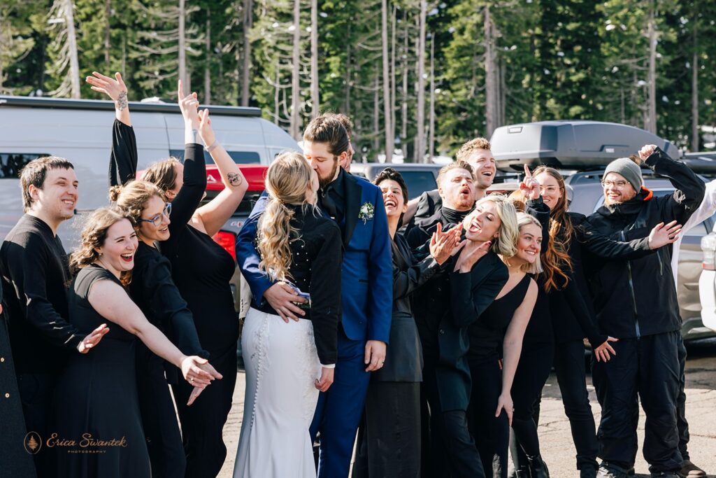 elopement couple surrounded by their cheering family and friends