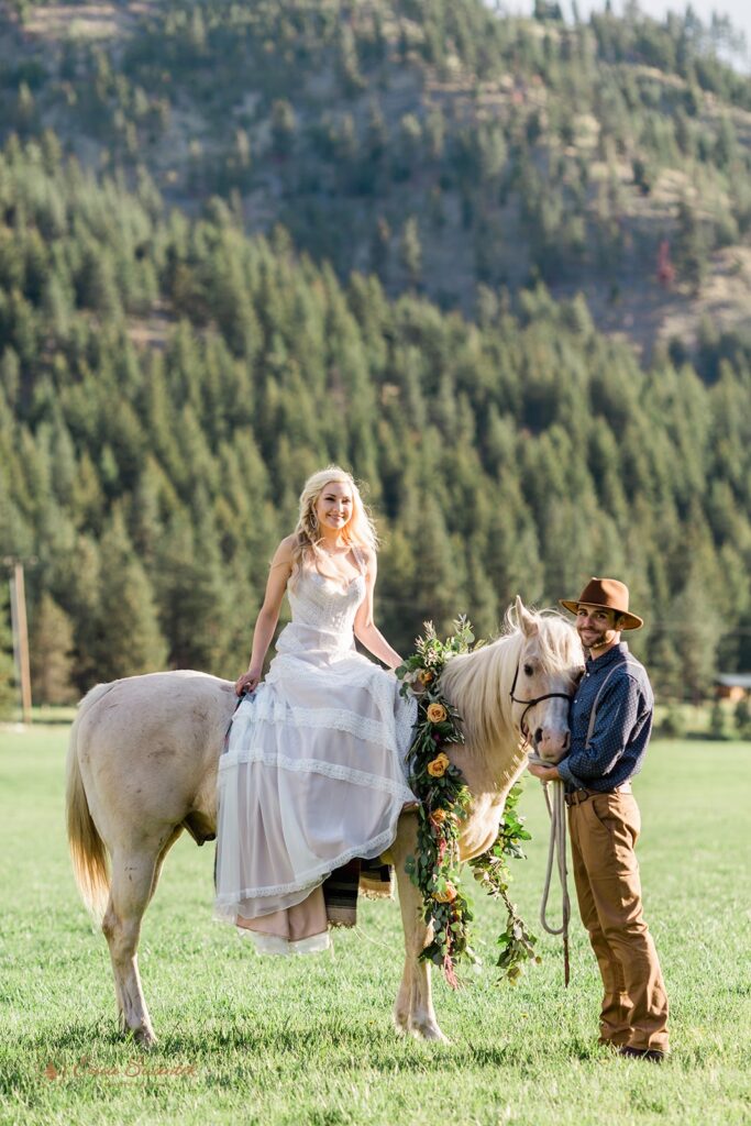 bride riding horseback during their Oregon elopement at Ochoco Mountains