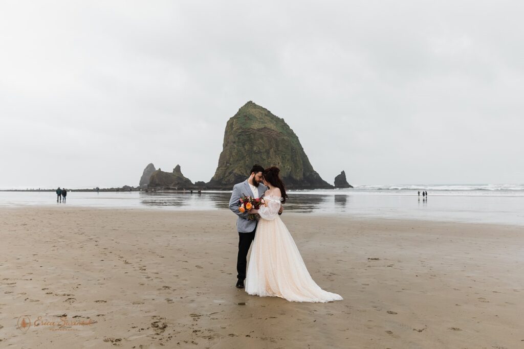 elopement couple in cannon beach, one of the most beautiful and moody oregon elopement locations