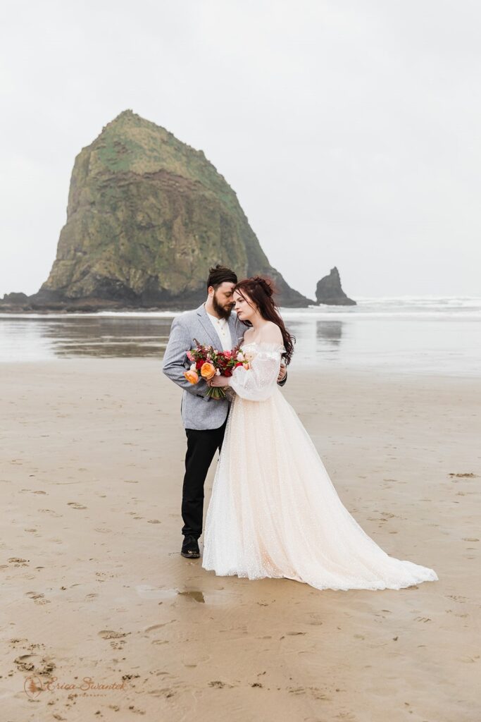elopement couple in cannon beach, one of the most beautiful and moody oregon elopement locations