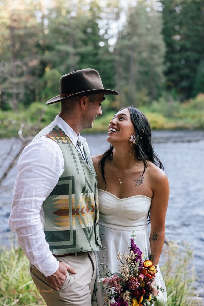 playful bride and groom moments during their Camp Sherman elopement in Oregon