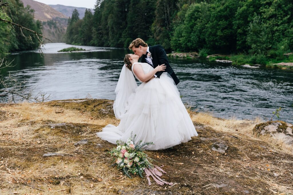 romantic bride and groom at the McKenzie River shore for their Oregon Elopement 
